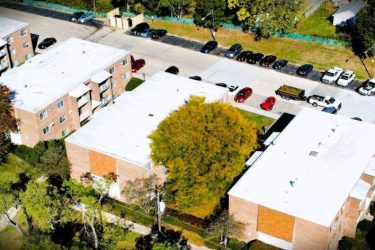 Molloy Roofing Company removed the existing roof system and installed a new Carlisle TPO roofing system with upgraded insulation, edge metals, gutters, and downspouts across the upper roof to improve energy efficiency, durability, and long-term performance.